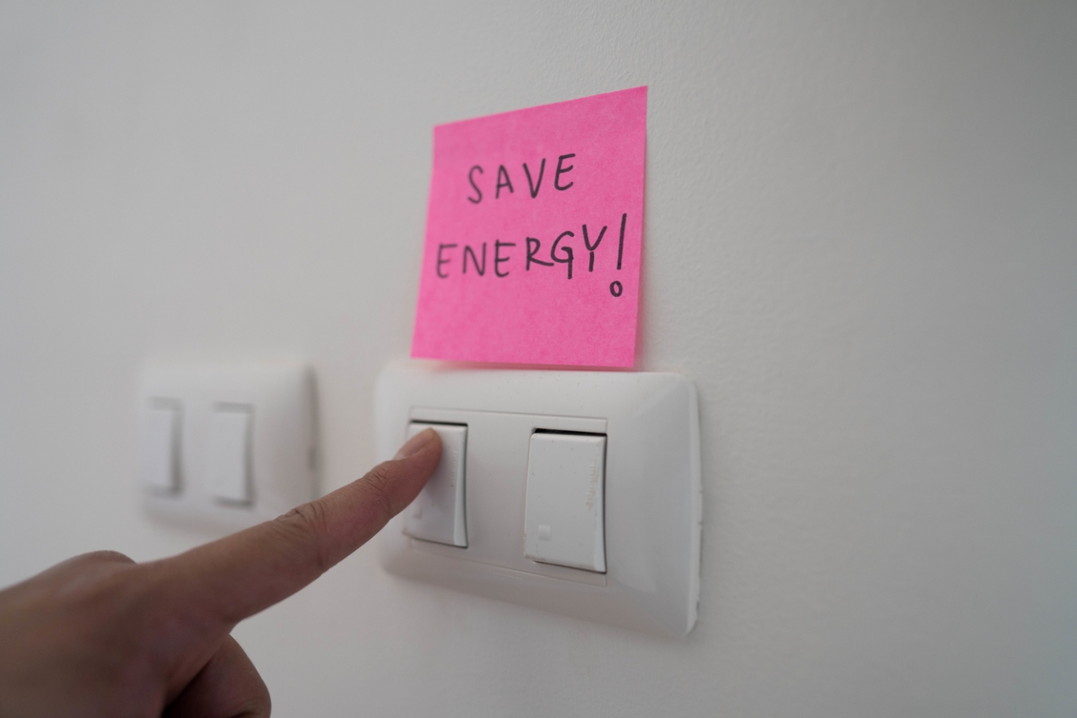 ways to save money at home - turning off light switch