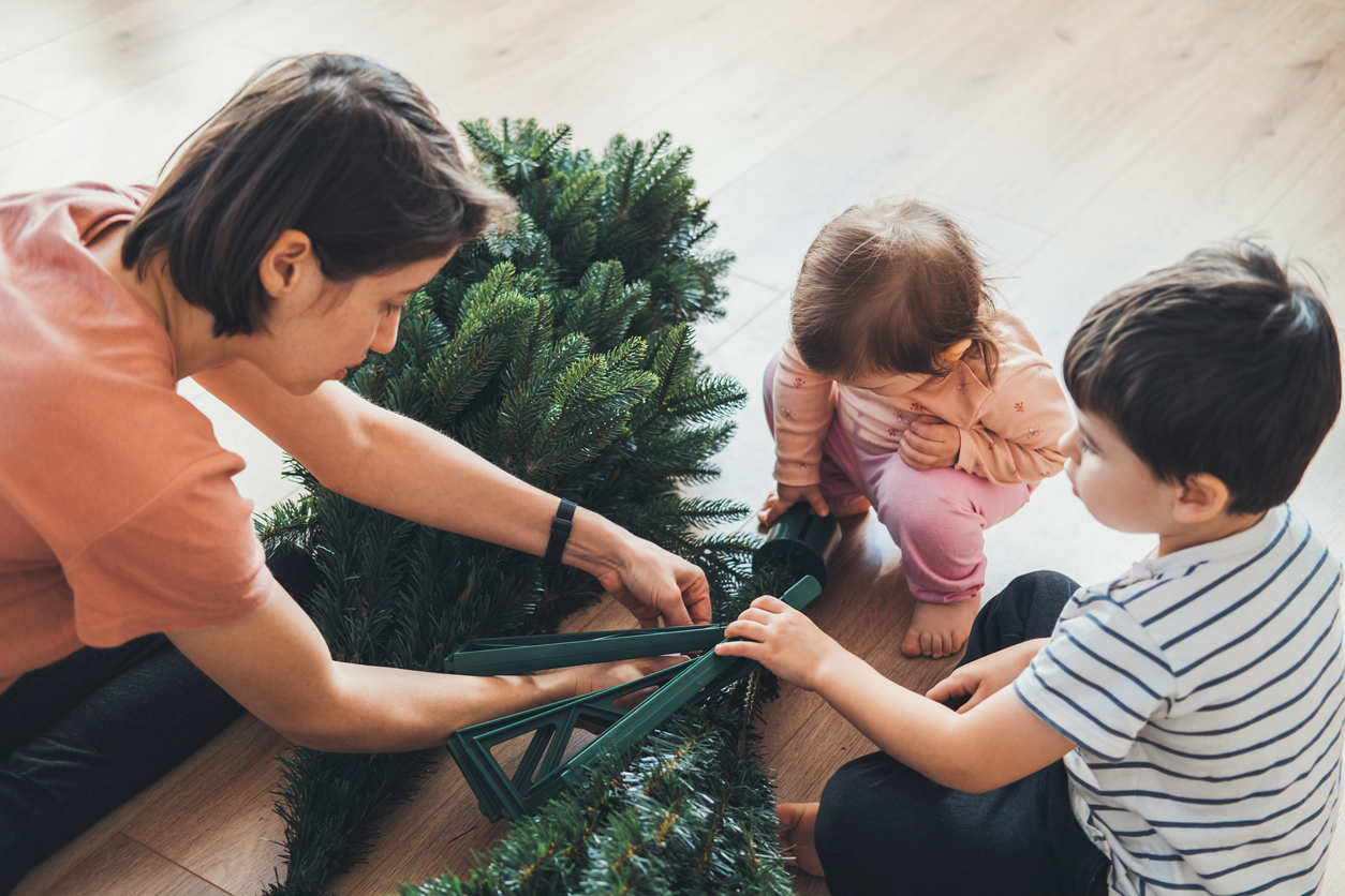 iStock-1435602698 Christmas tree care setting up artificial tree