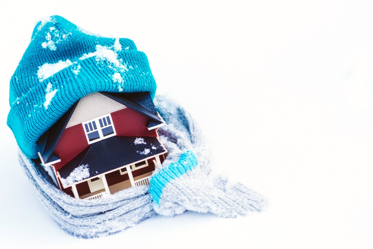 iStock-523752809 winterize your home home wrapped in hat and gloves winterizing concept.jpg