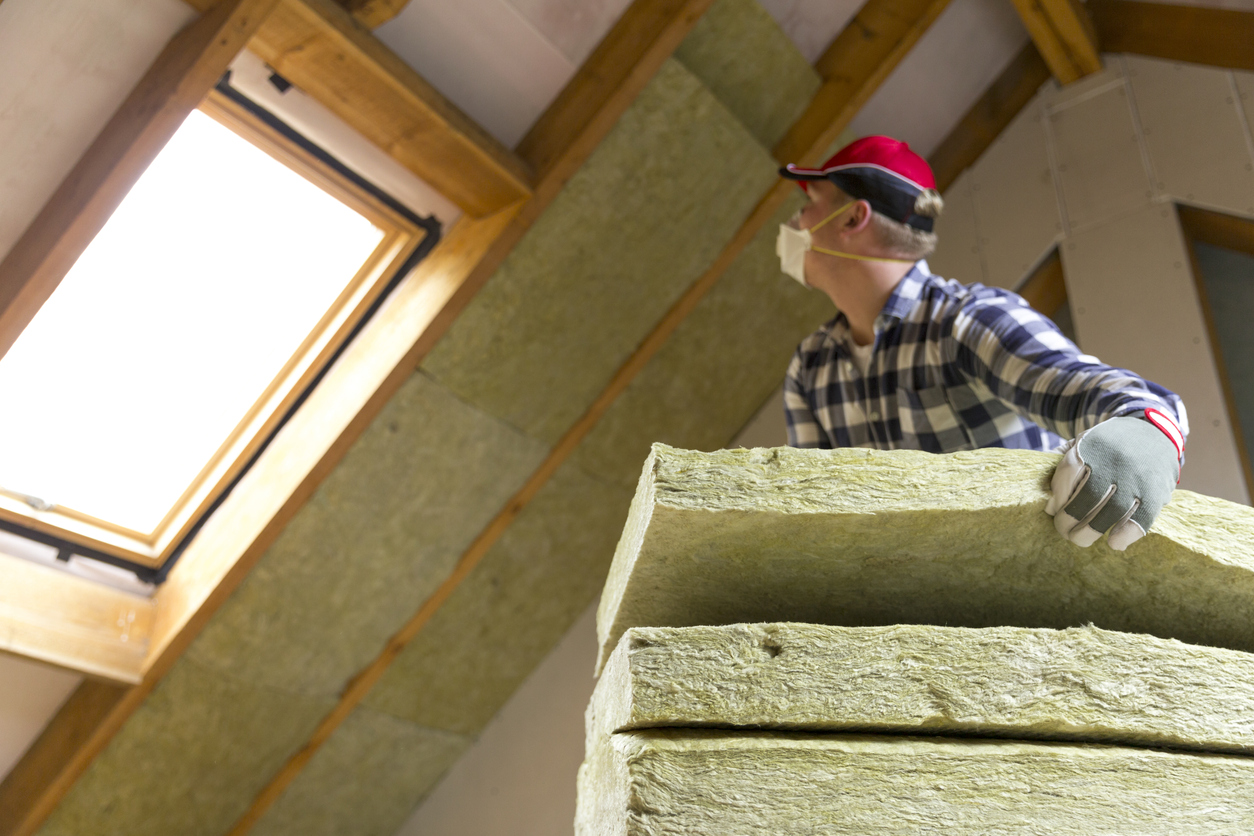 iStock-873936804 rebatees and tax credits insulating attic with mineral wool.jpg