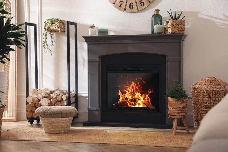 Stylish room interior with electric fireplace and beautiful decor elements.