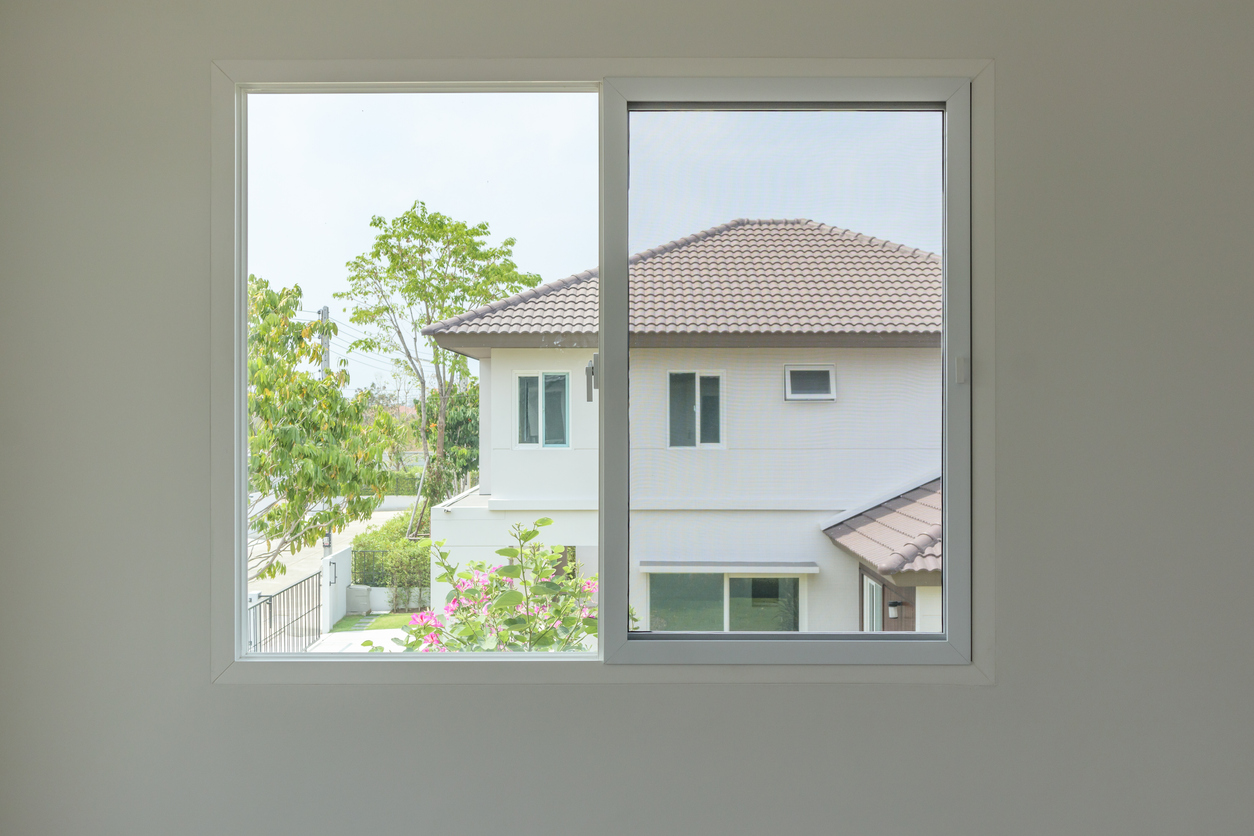 iStock-1343023036 real estate agents dont want sliding glass window looking out into neighboring house
