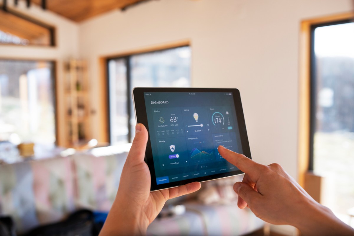 The 11 Biggest Mistakes You Can Make With Your Smart Home using smart home system on tablet in living room