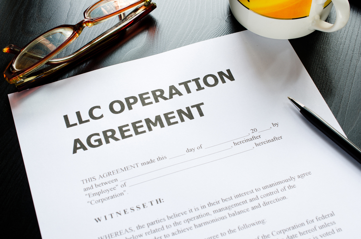 iStock-158734256 why not to own a house in your name LLC operation agreement paperwork