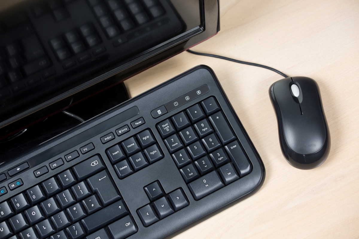 how to clean a keyboard - black keyboard with mouse