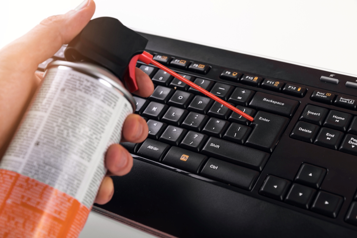 how to clean a keyboard - cleaning with compressed air