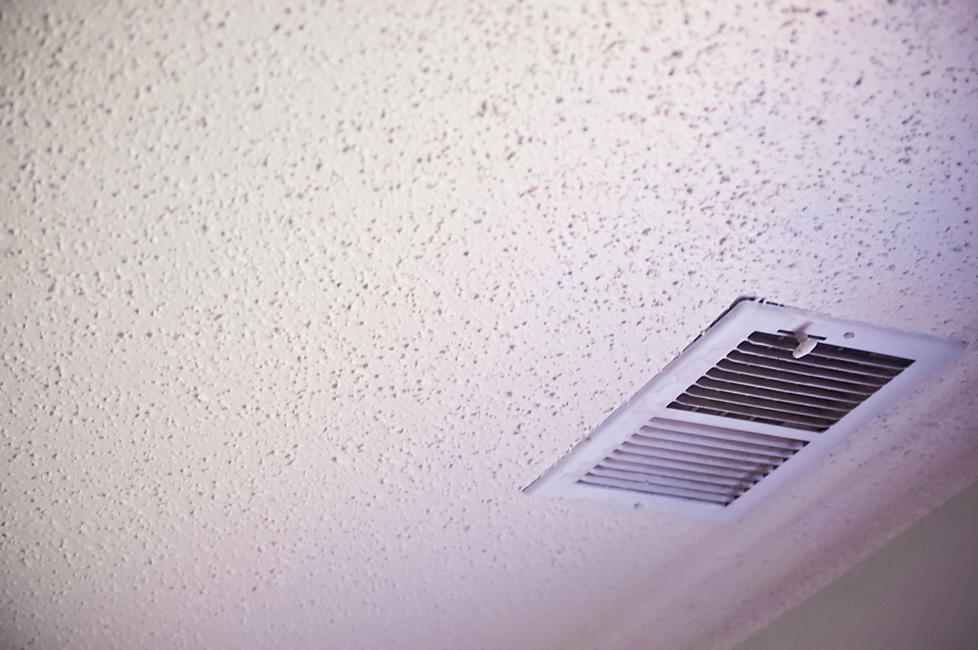 white popcorn ceiling with air vent
