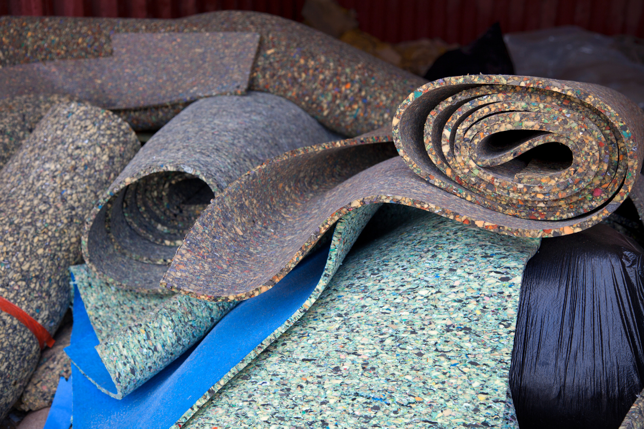 Carpet padding in a recycling pile