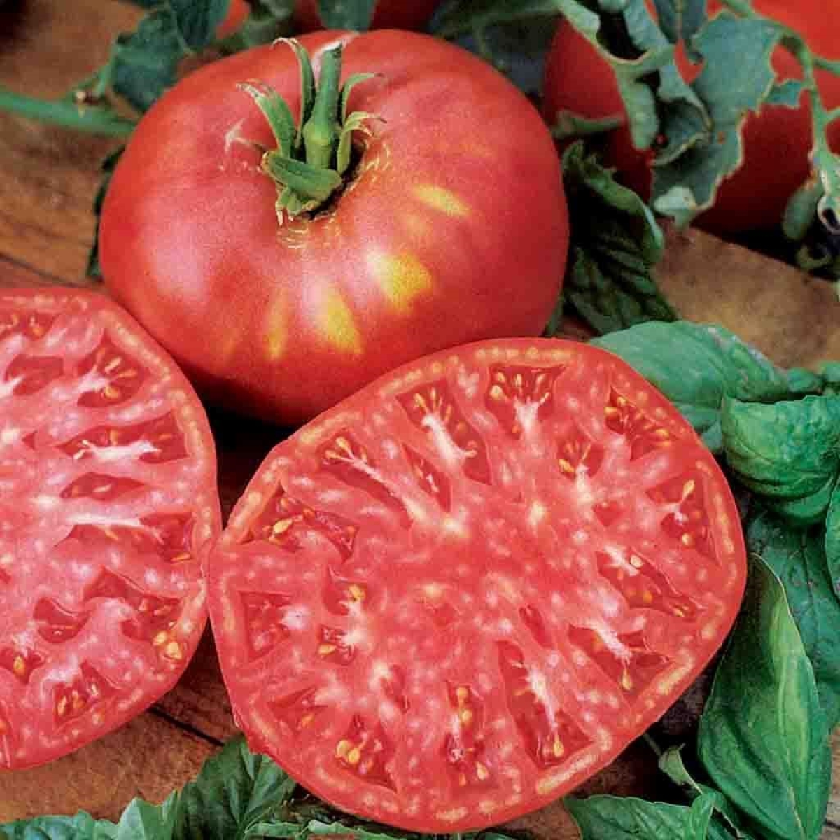 types of tomatoes - sliced red heirloom tomato