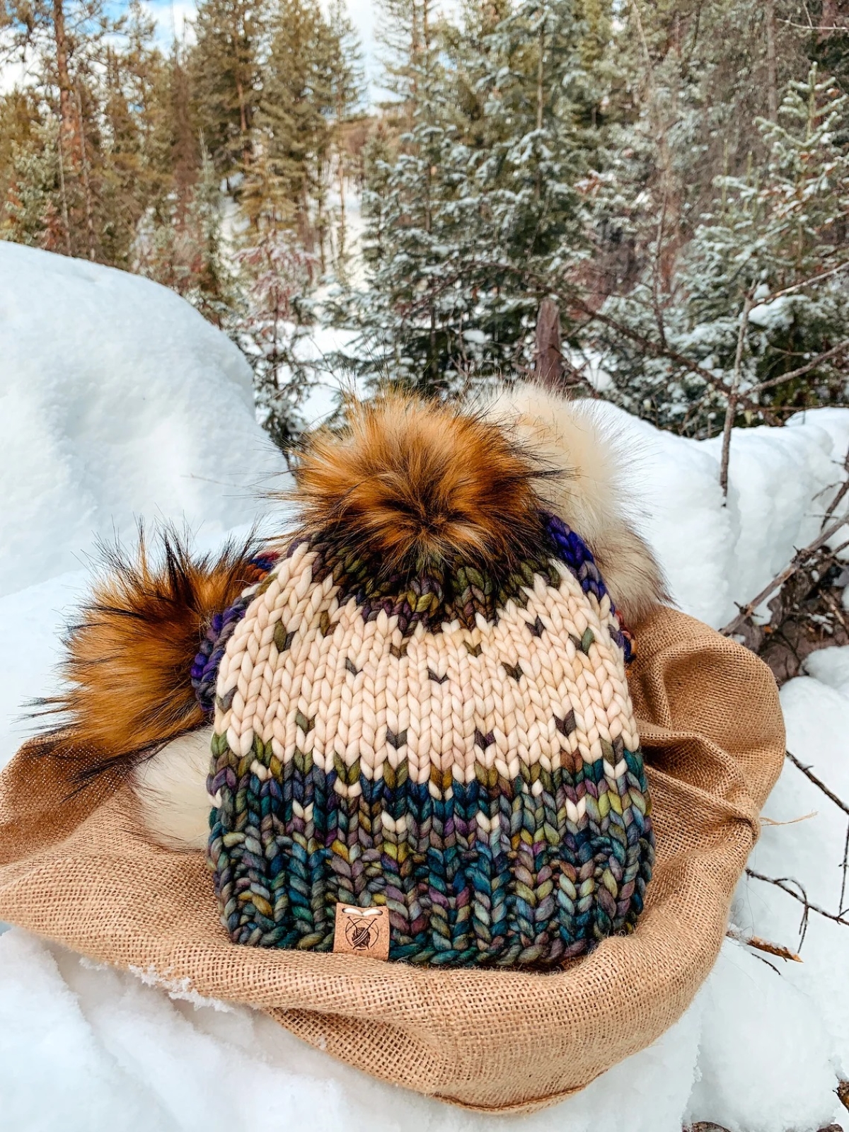 knitting patterns for beginners - knitted colorful beanie on snowy ground