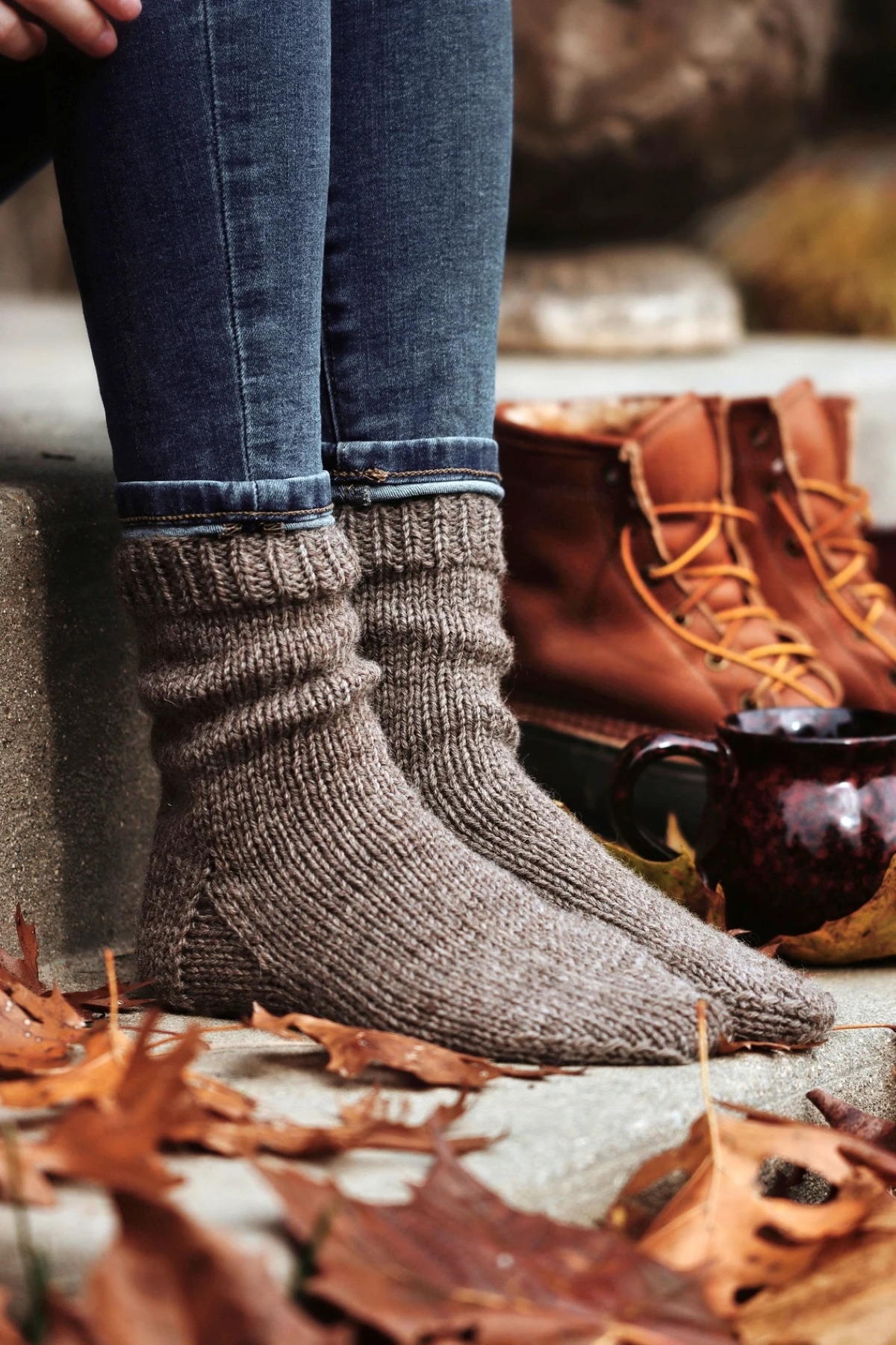knitting patterns for beginners - woman wearing knitted socks in fall