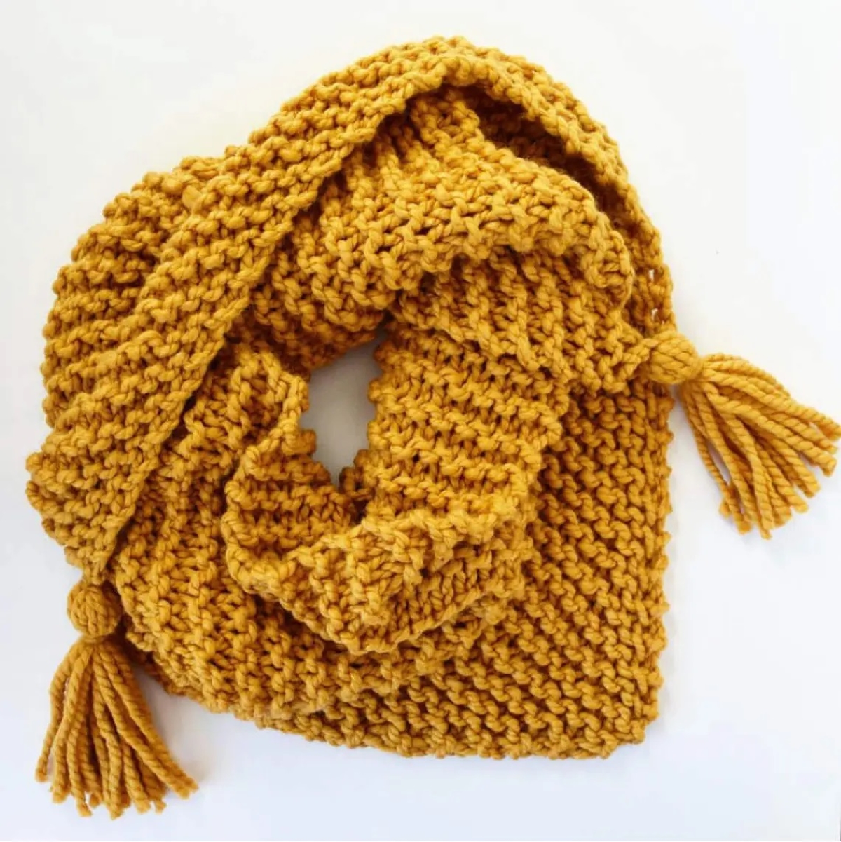 knitting patterns for beginners - yellow knitted triangle scarf