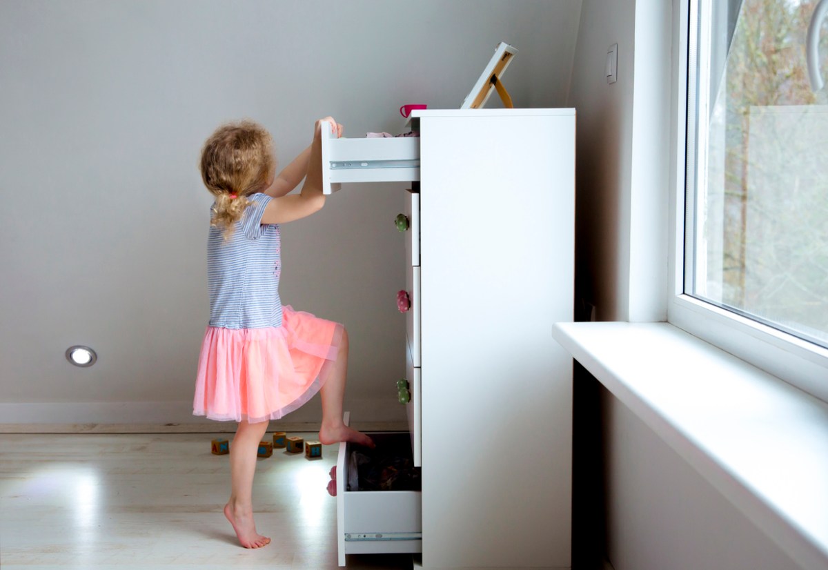 how to anchor furniture to wall child climbing onto dresser unstable