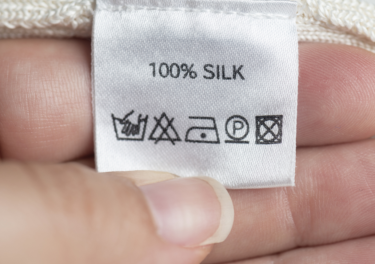 14 things you didn't know you can clean in your washing machine silk clothing label hand wash concept