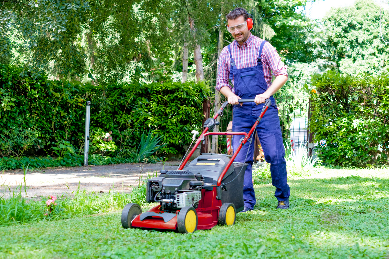 iStock-1261158347 tax refund home improvements One guy portrait cutting the garden grass
