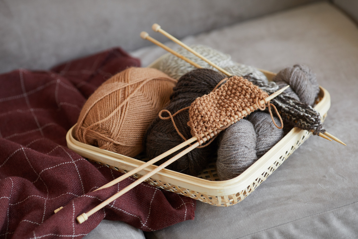how to knit for beginners - basket of knitting supplies