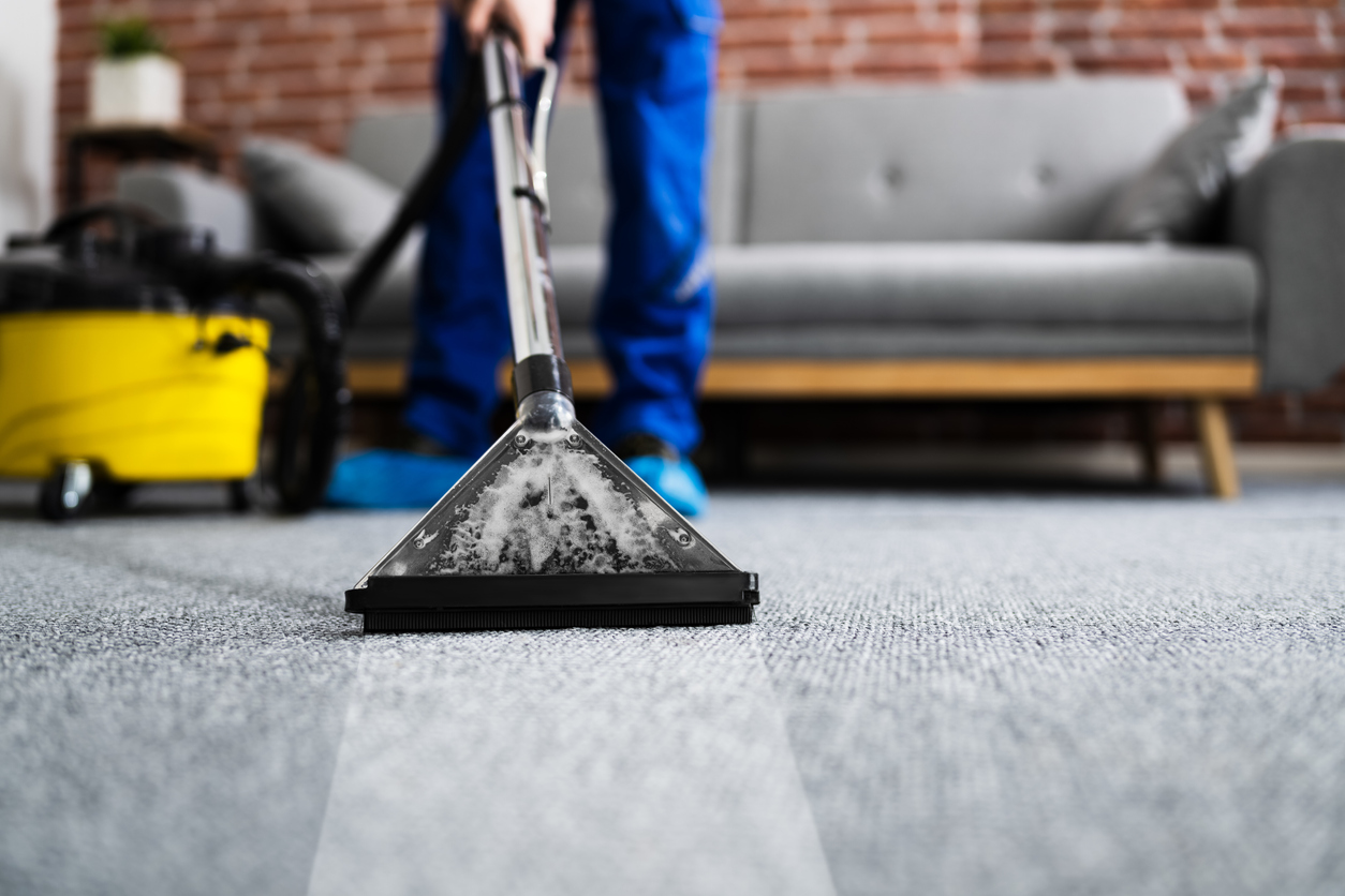 iStock-1291113951 tax refund home improvements Janitor Cleaning Carpet With Vacuum Cleaner