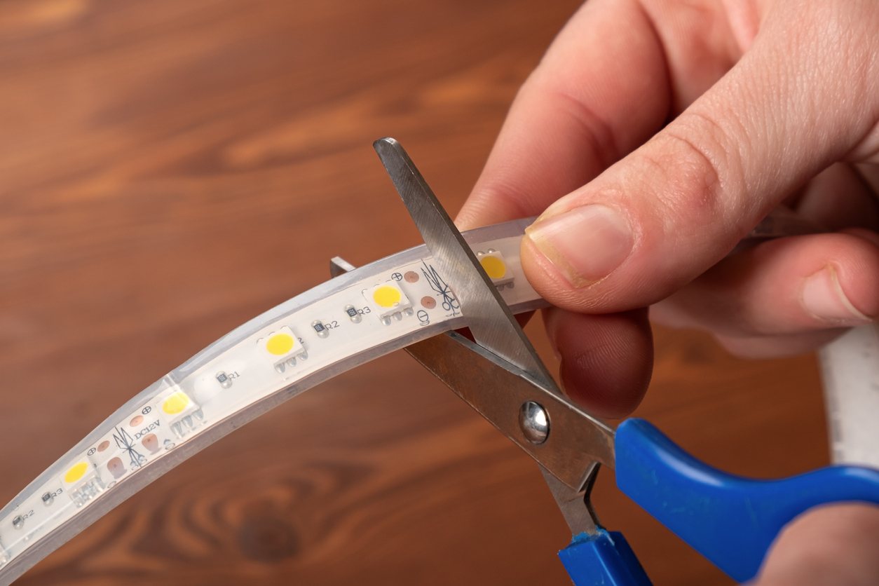 iStock-1310279050 how to install led strip lights Cutting off led strip,installation of diode lighting.