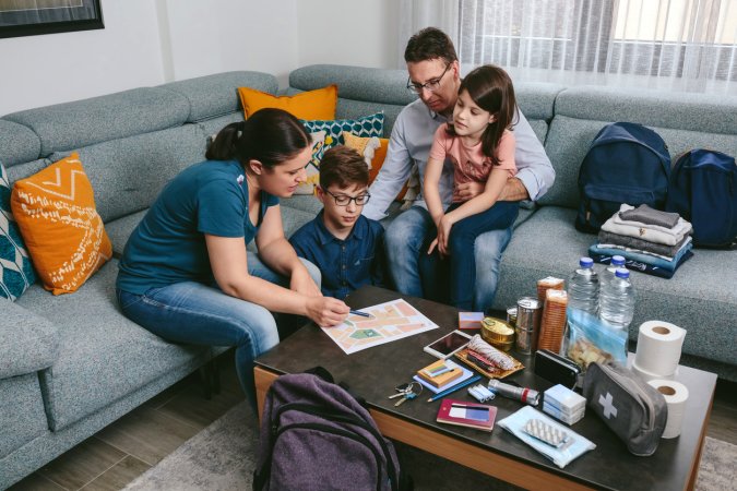 iStock-1328295373 evacuation order Mother explaining to her family the emergency assembly point
