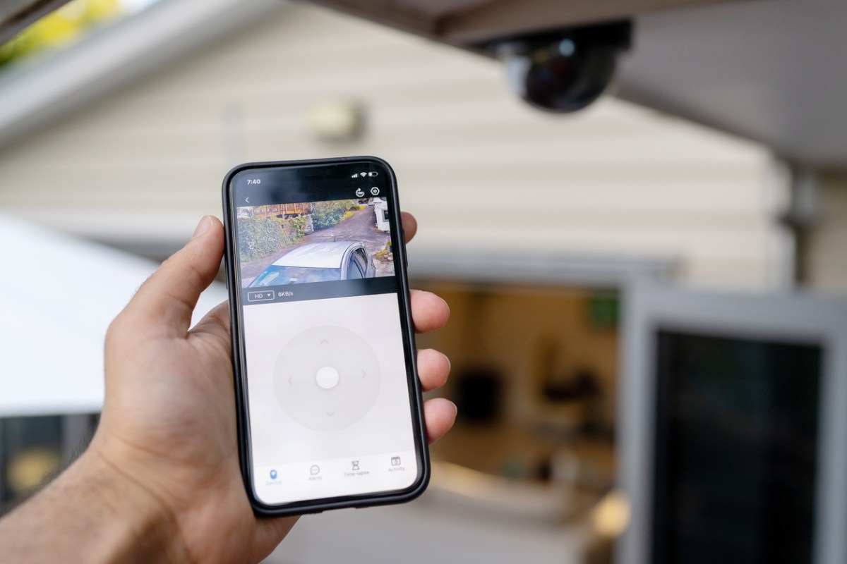iStock-1357194101 video doorbell Using Smart phone to check security camera footage