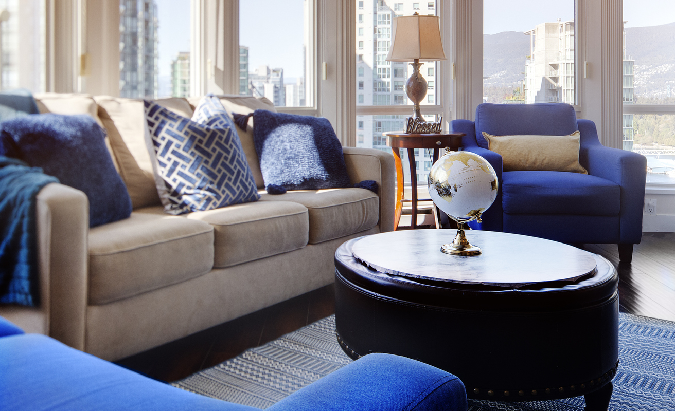 Nicely designed interior space furniture staging with blue and beige decor.