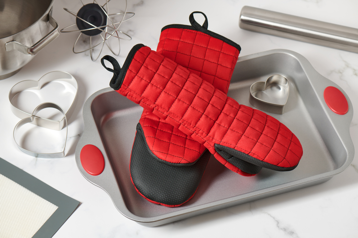 14 things you didn't know you can clean in your washing machine red oven mitts in baking pan