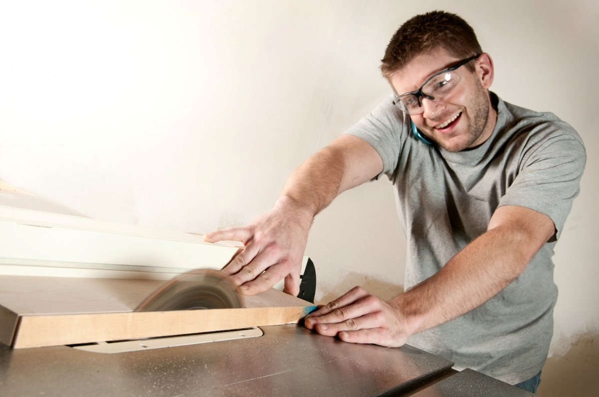 most dangerous power tools - man on phone using table saw