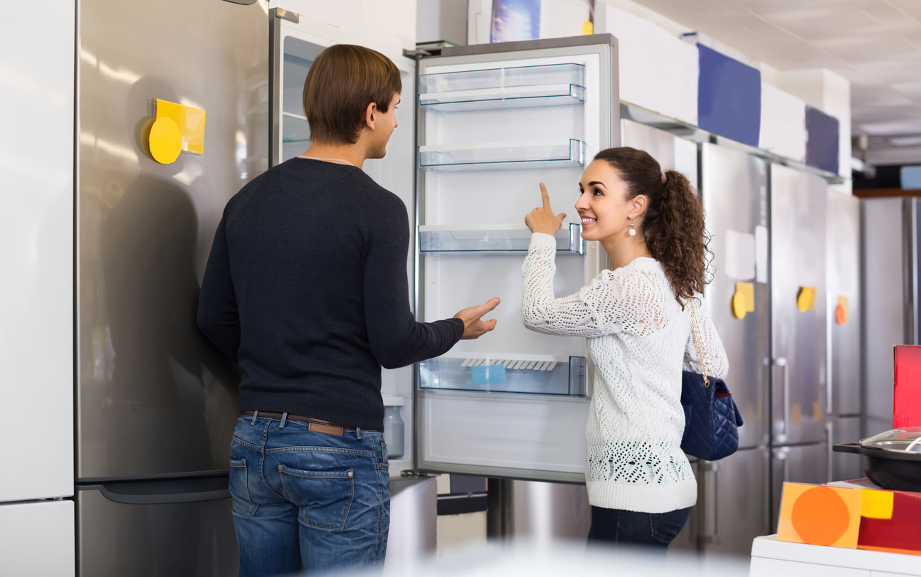 iStock-520324302 tax return home improvementsFamily couple choosing new refrigerator in hypermarket