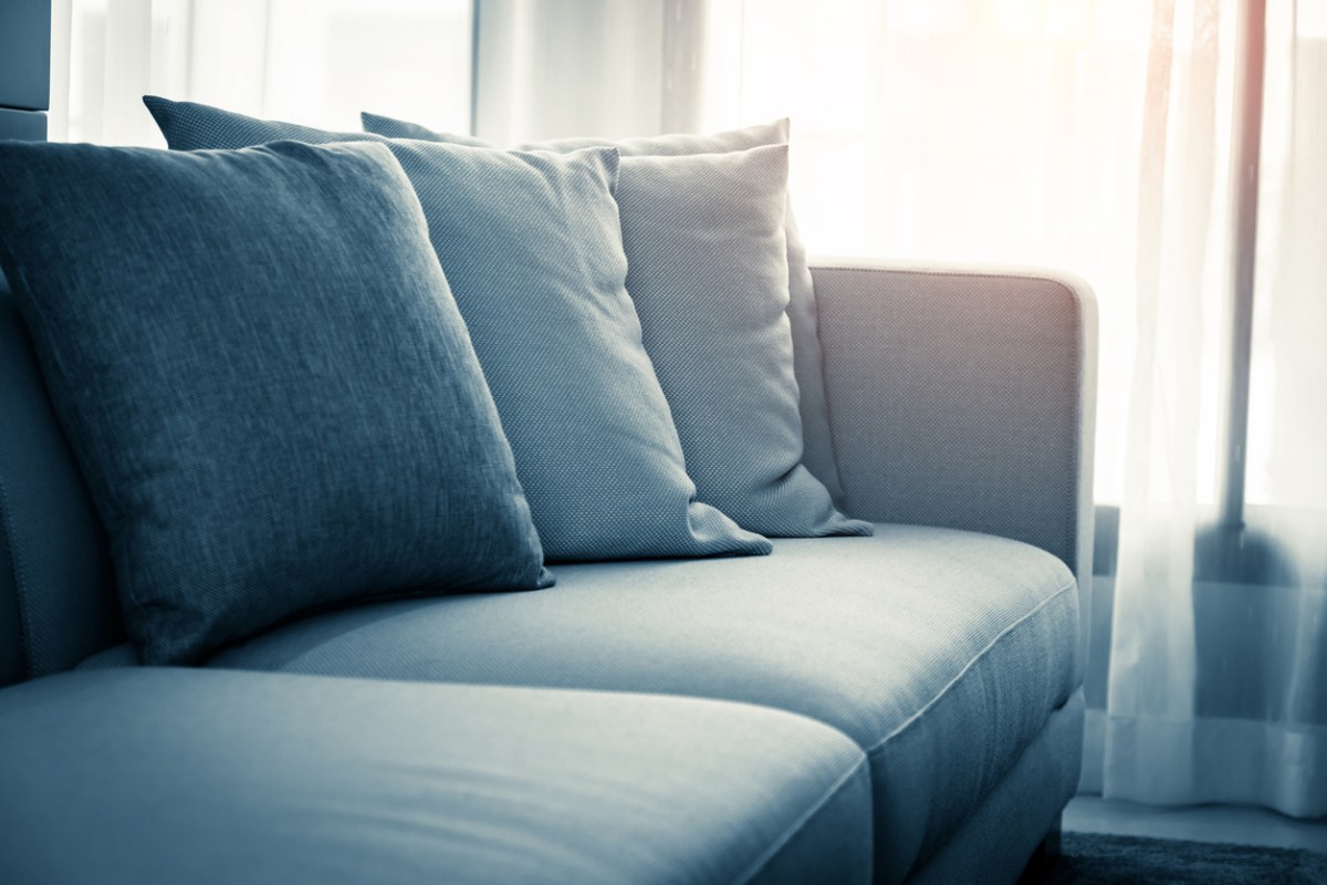 how to reupholster a couch close view on blue couch texture bright natural light
