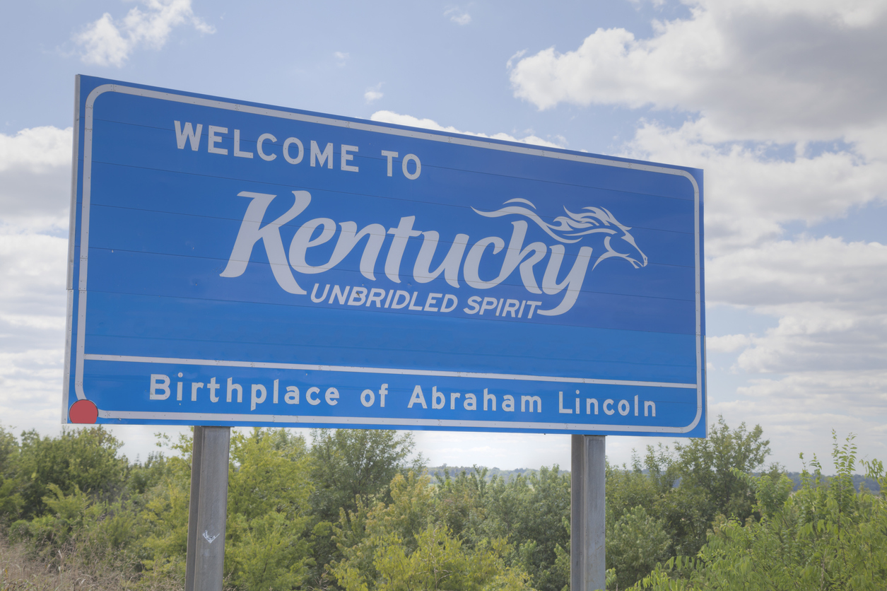 iStock-667575840 cheapest places to buy land welcome to kentucky road sign