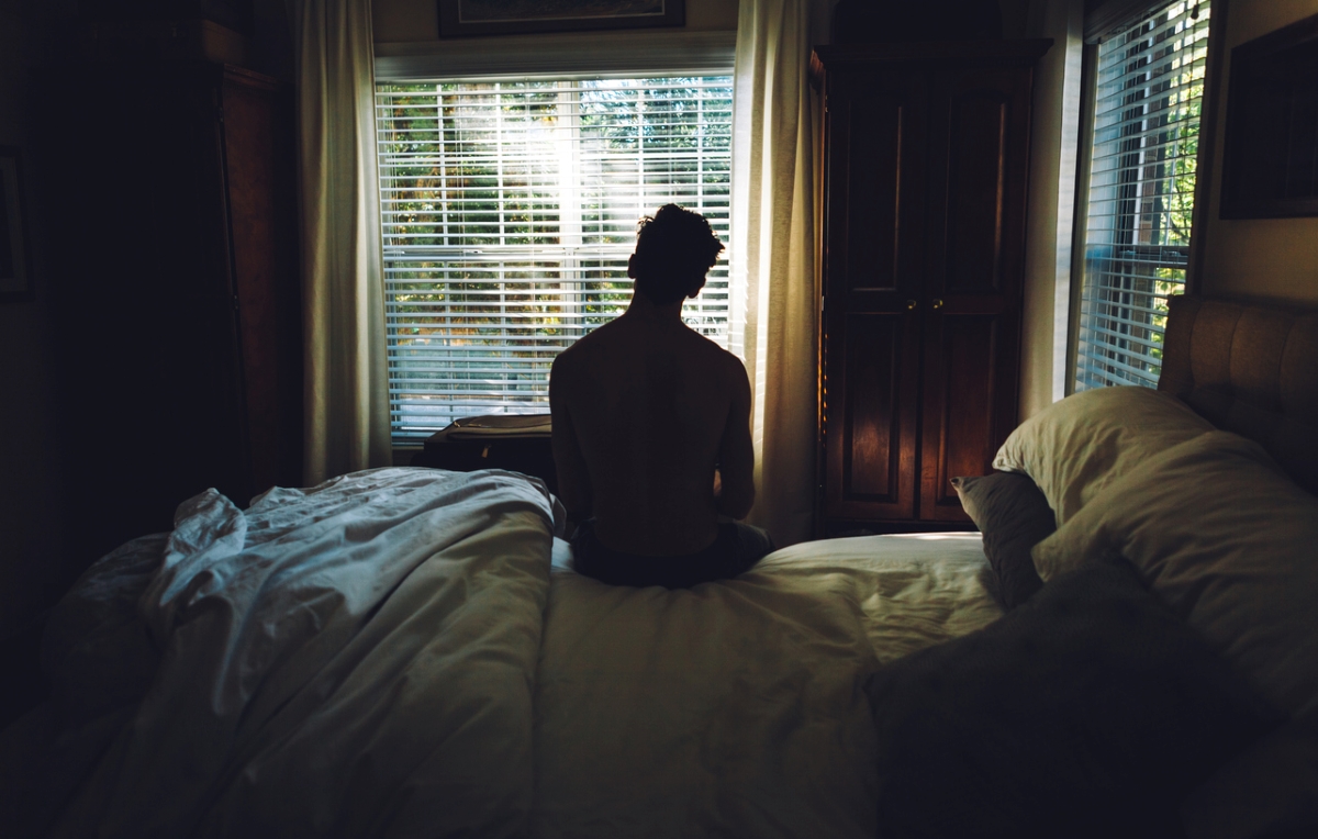 daylight savings time 2023 - man waking up facing sunlight
