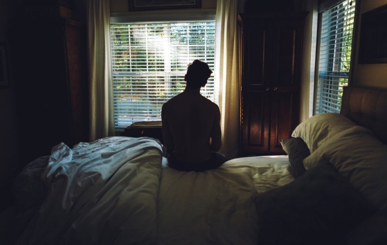 daylight savings time 2023 - man waking up facing sunlight