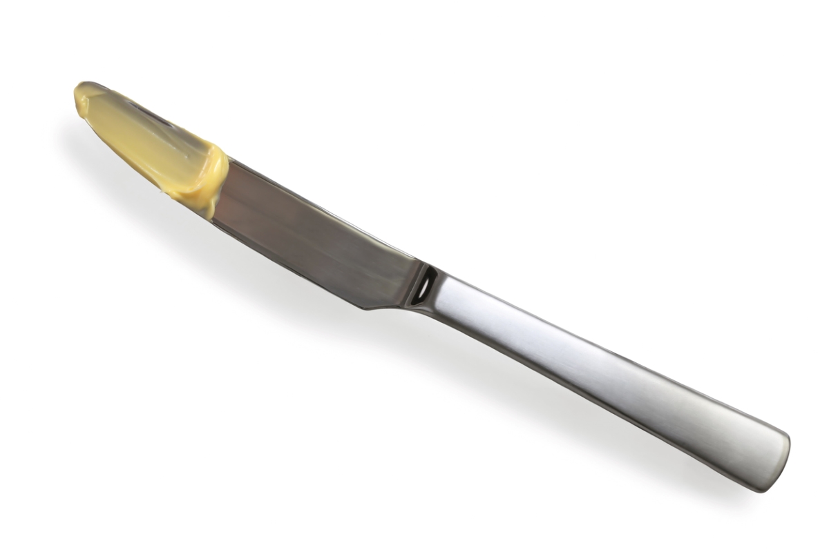 ways to clean behind and under every appliance - butterknife with yellow substance