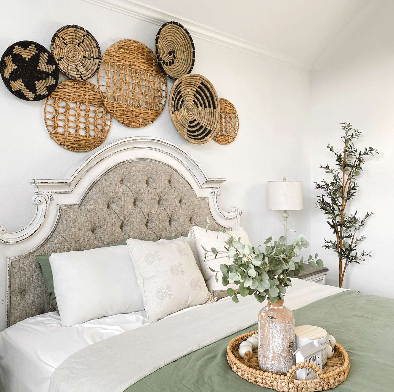 Etsy Wall Decor Ideas baskets hanging over bed with green spread