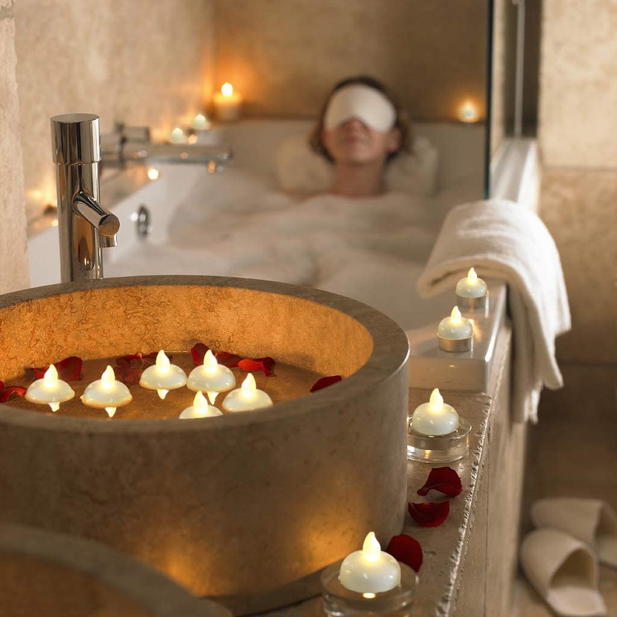 decor with candles - tea light candles around woman in tub