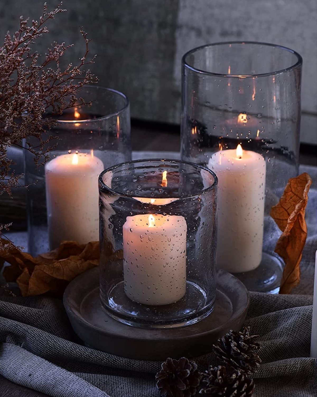 decor with candles - trio of hurricane candles in the dark
