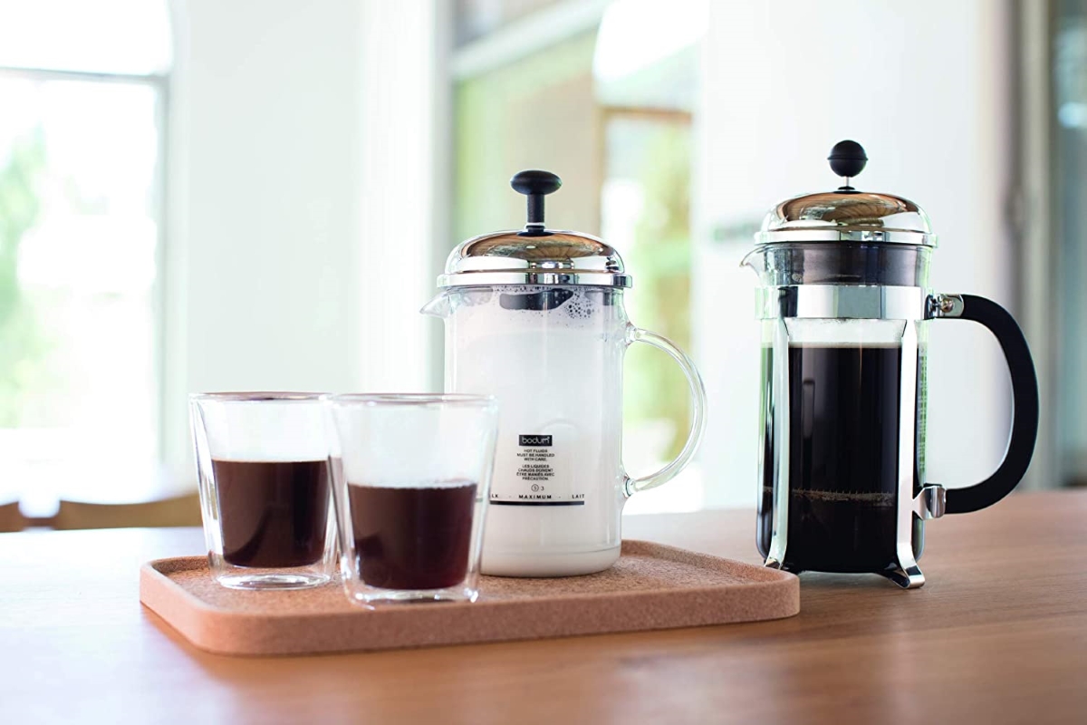 types of coffee makers - french press next to cups of coffee
