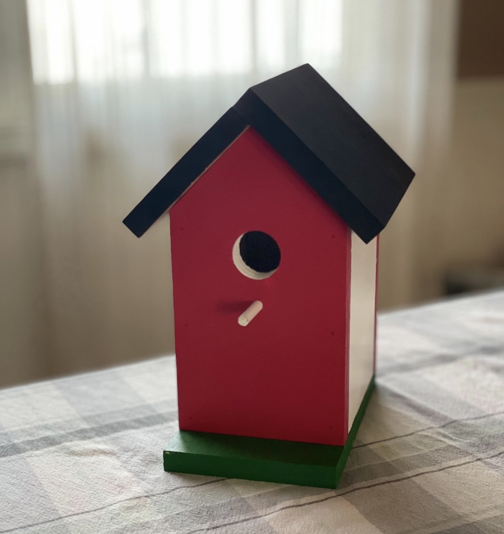 Simple wood birdhouse, red with black roof