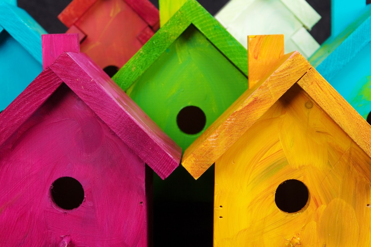closeup of colorful painted birdhouses