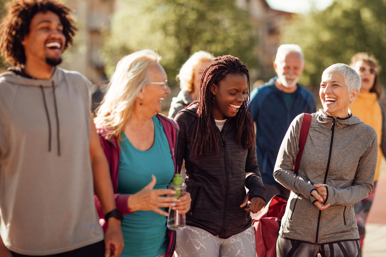 iStock-1153816876 master planned community Smiling group of people walking together outdoors