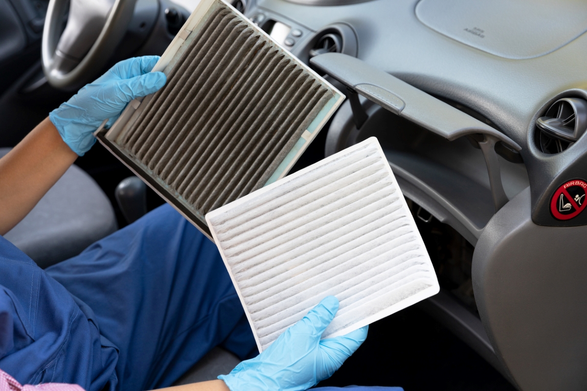 car maintenance tasks - person holding two air filters
