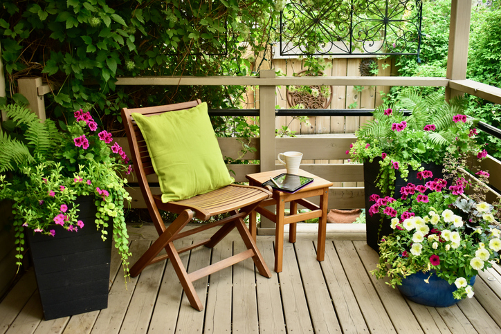 pocket-garden-small-deck-with-flowers-and-wooden-chair-for-reading-and-coffee