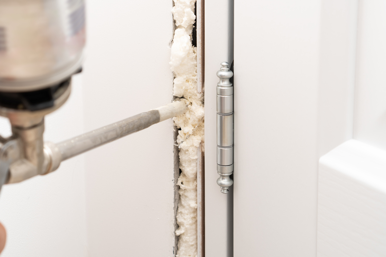 iStock-1394844128 how to insulate a shed spraying foam into door