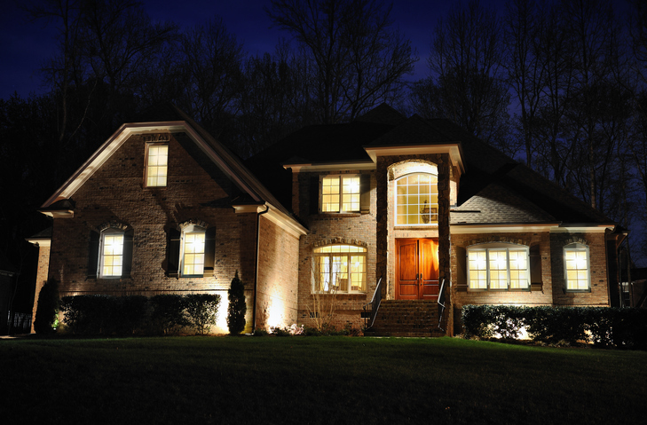 uplighting-landscape-two-story-house-at-night-with-uplighting-on-facade