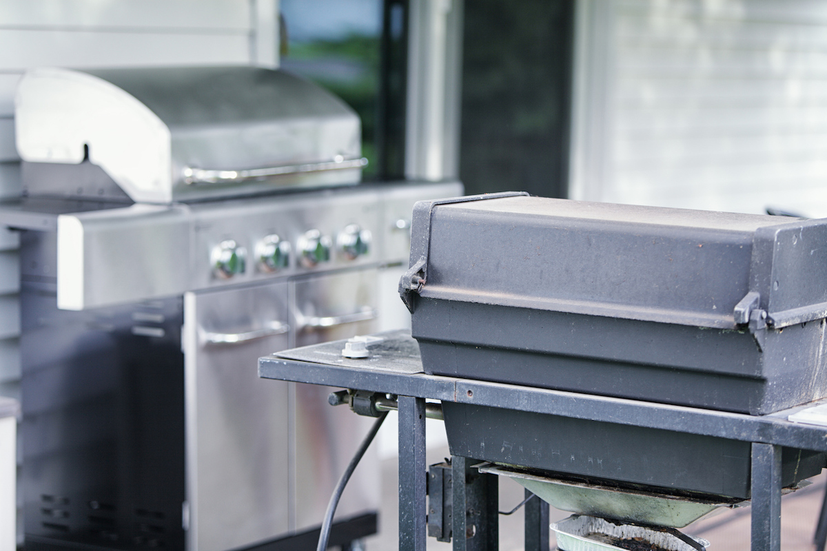 how to dispose of a grill properly - old grill and new grill on patio