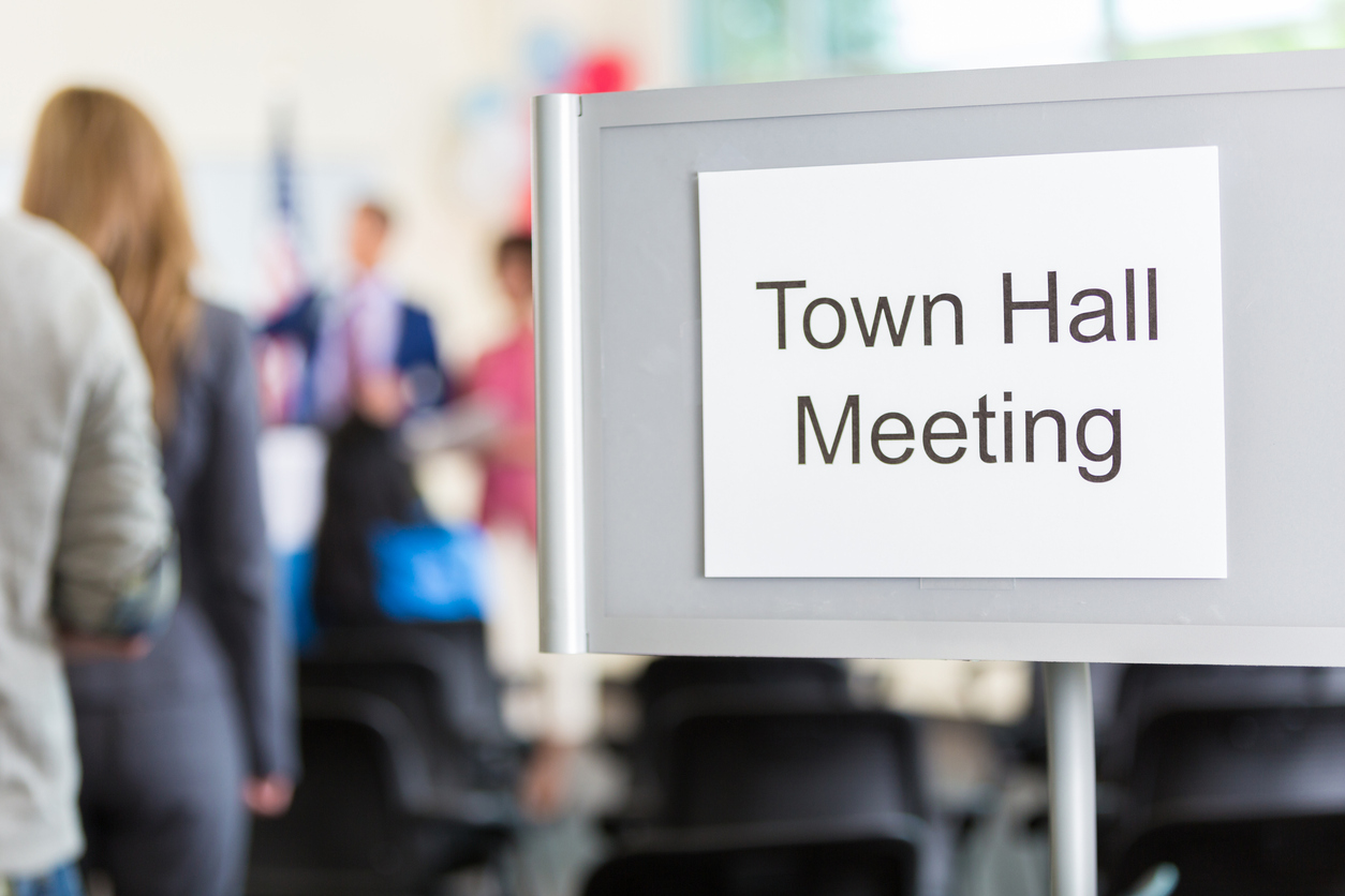 iStock-639522866 save money gardening Close up of 'Town Hall Meeting' sign