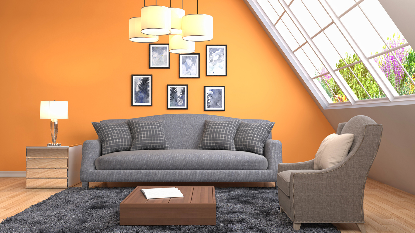 iStock-686988626 Wall Decor Ideas living room with orange accent wall and art hanging on wall