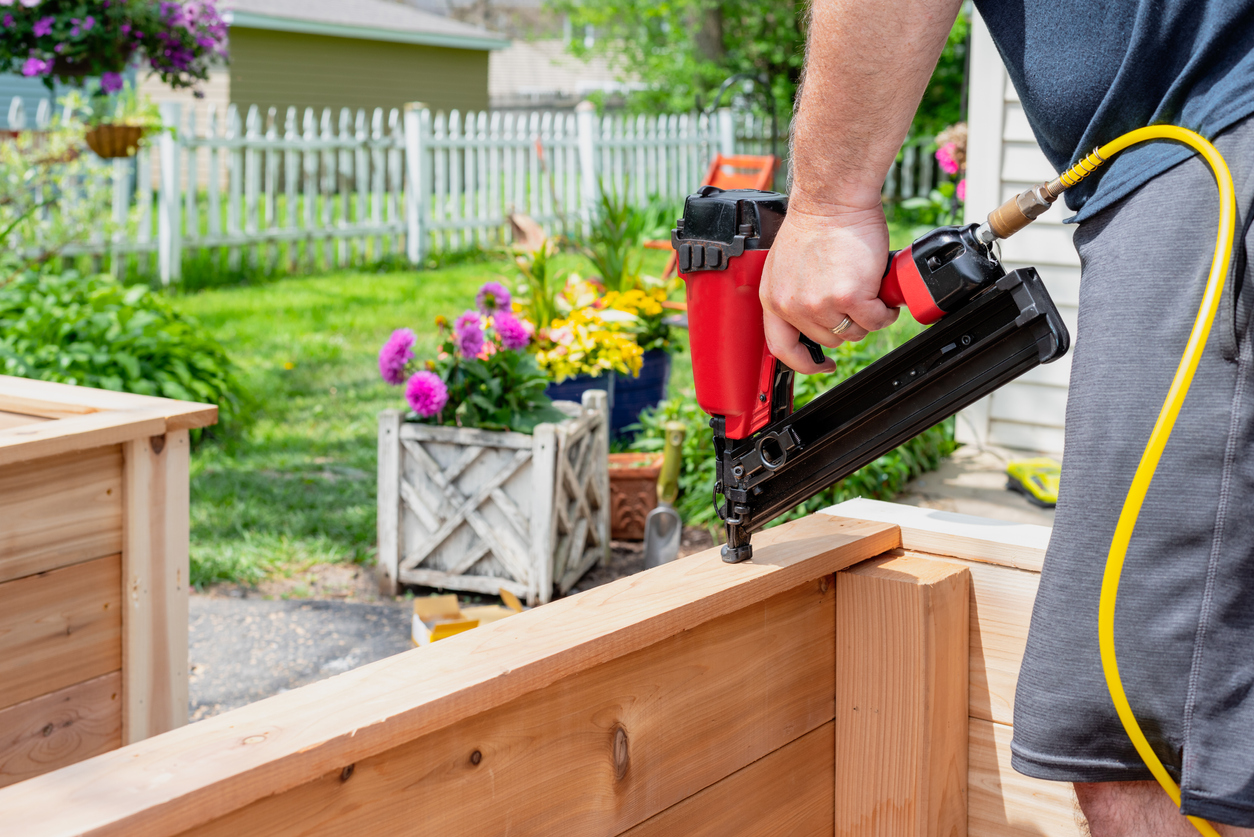 landscaping mistakes that make home buyers look the other way man fixing deck diy