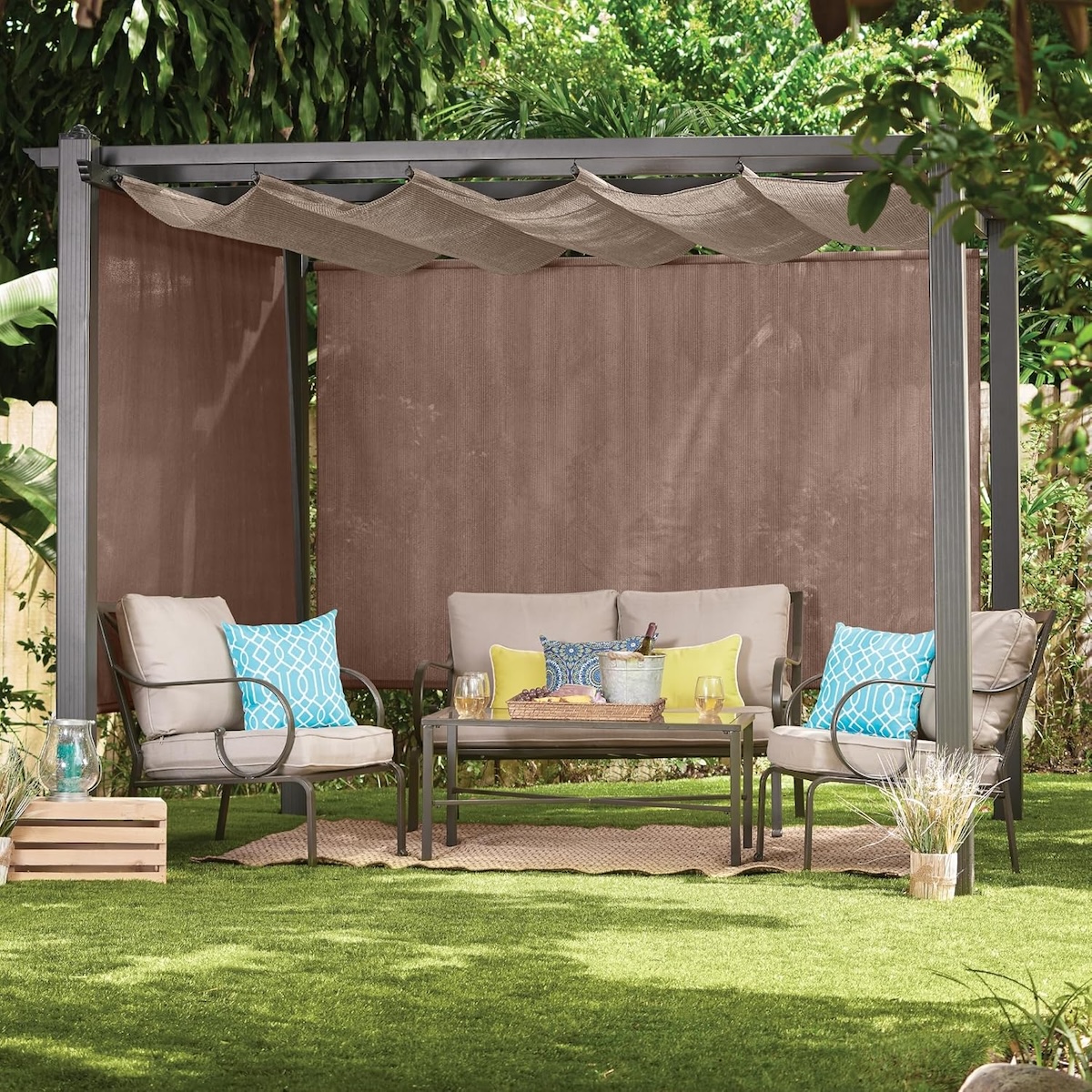 An outdoor gazebo area with grey blinds. 