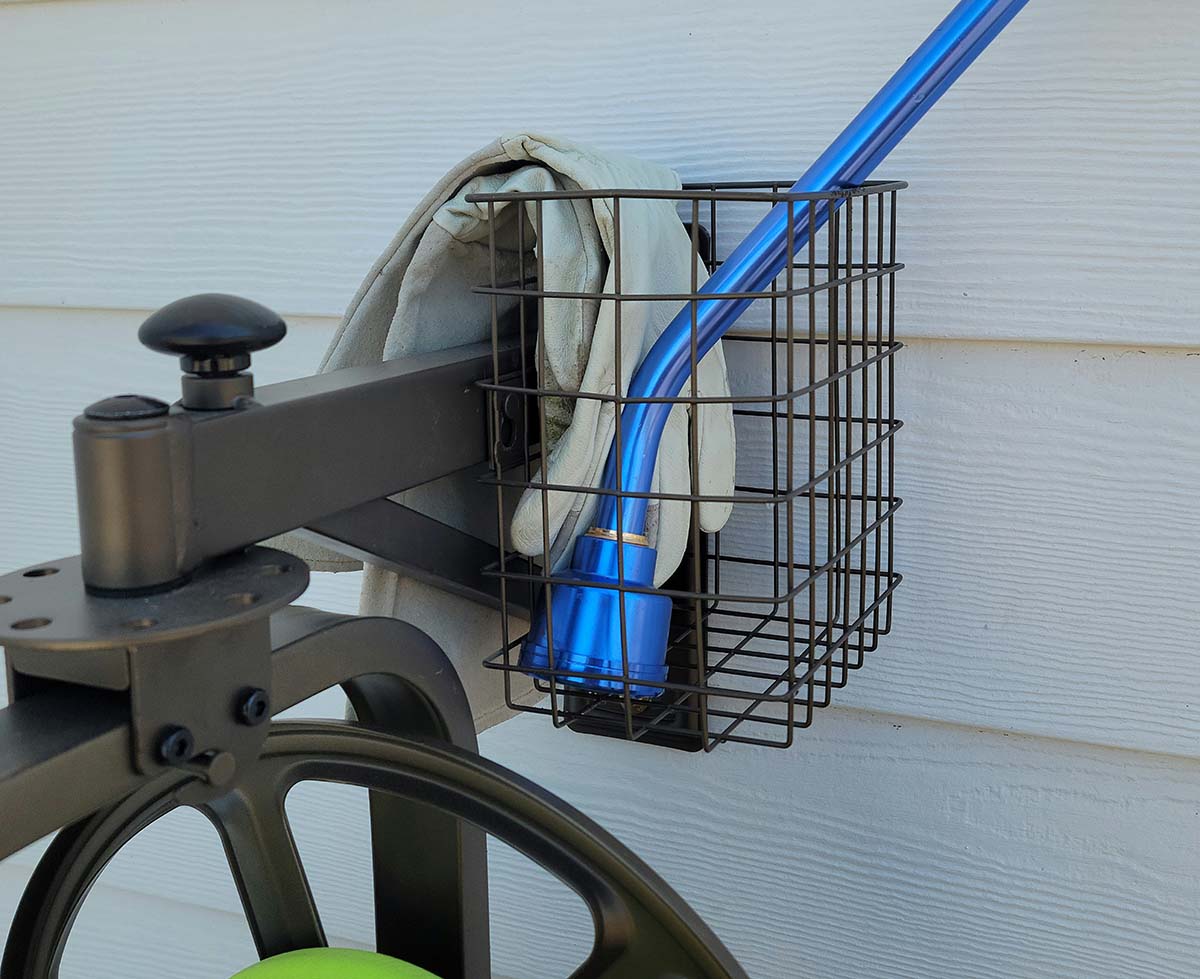 Blue garden hose wand in basket of liberty hose reel